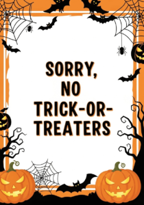 A sign with the text "sorry, no trick-or-treaters" in black and an orange border with spooky trees, jack-o-lanterns, and spiderwebs.